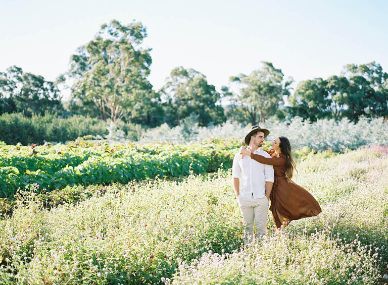 couple portrait in flower fields with Zimmerman gown